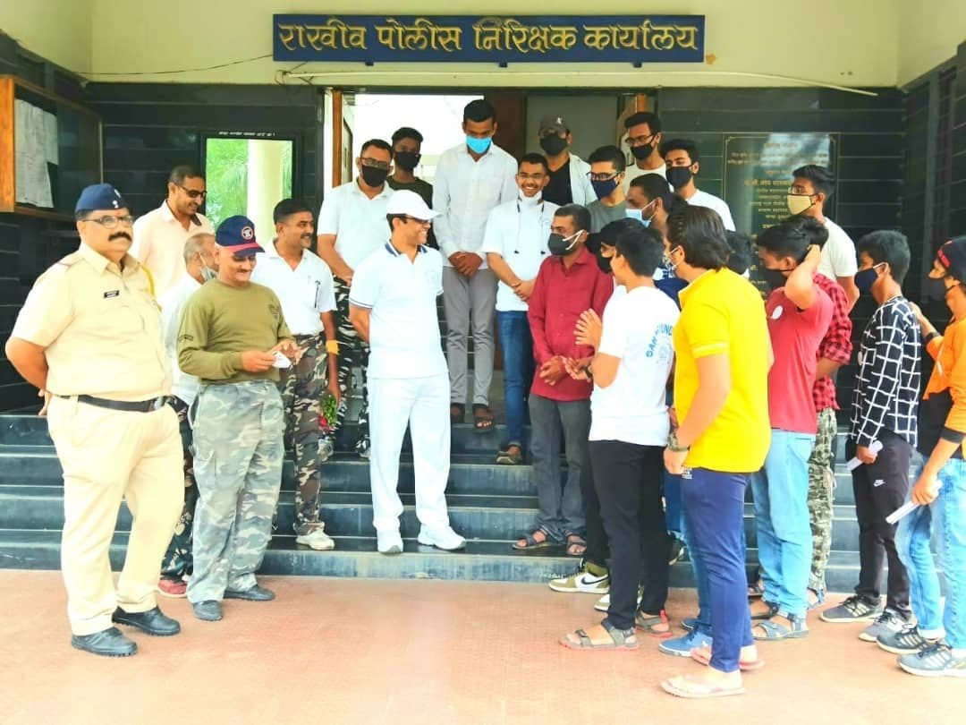 Volunteers with police and fire officers at the fire-safety training, Dhule, 2021
